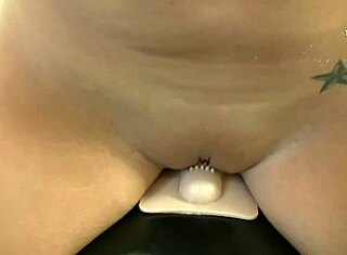 Big tit brunette enjoys solo play with Sybian